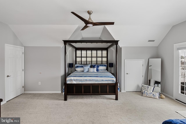 carpeted bedroom featuring vaulted ceiling and ceiling fan