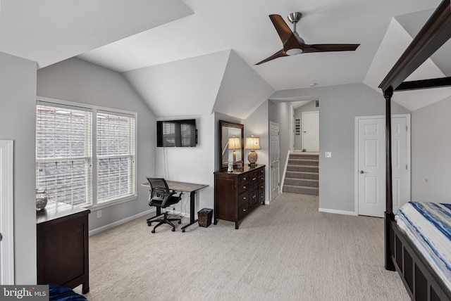 bedroom featuring light carpet, ceiling fan, and vaulted ceiling