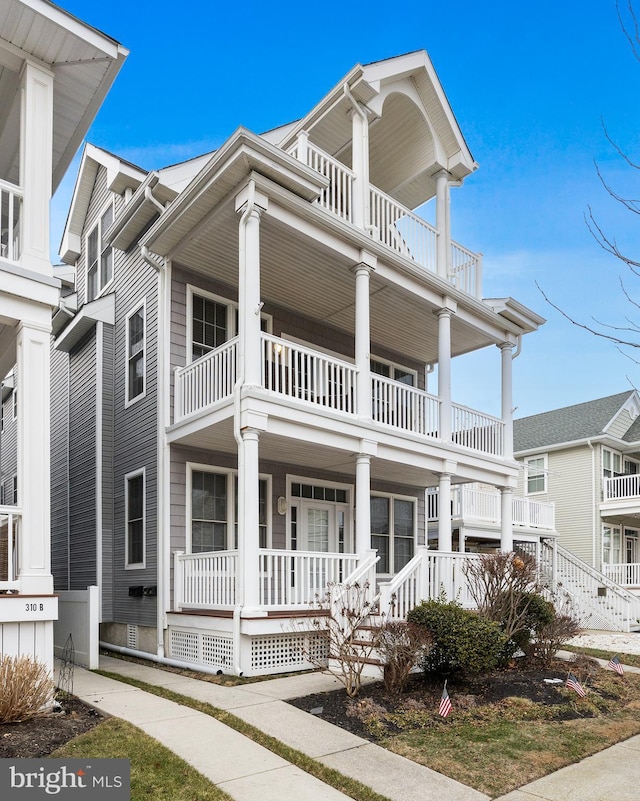 view of front of home with a balcony and a porch