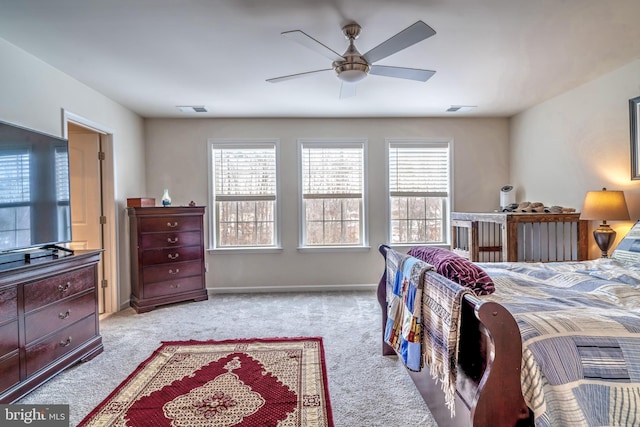 bedroom with ceiling fan and light colored carpet