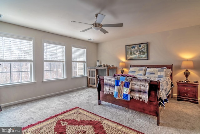 bedroom with ceiling fan and light colored carpet