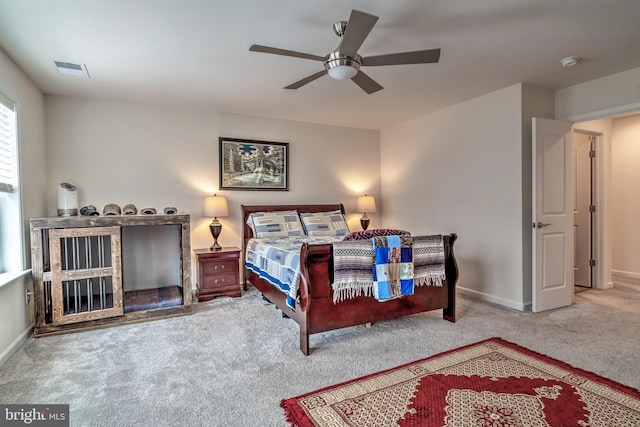 bedroom with ceiling fan and light carpet