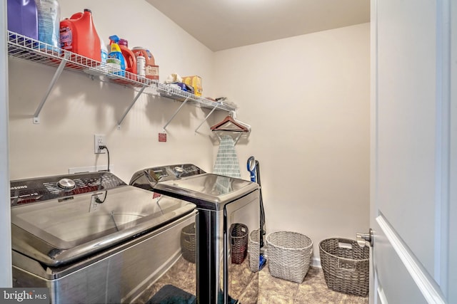 laundry area with independent washer and dryer