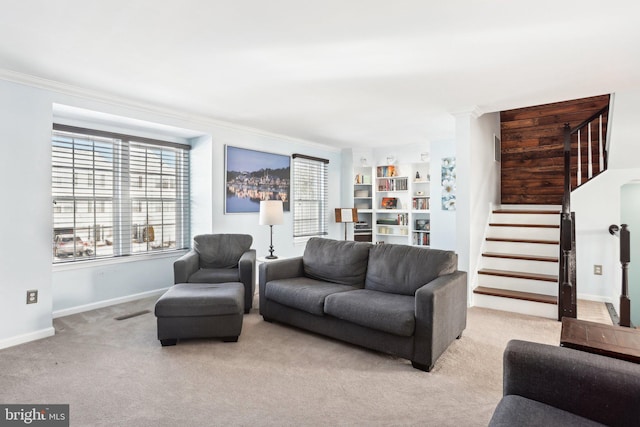 living room with ornamental molding and light colored carpet