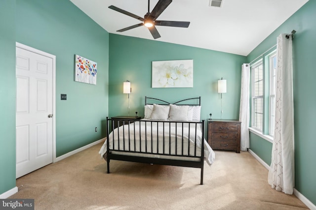 bedroom with ceiling fan, light colored carpet, and lofted ceiling