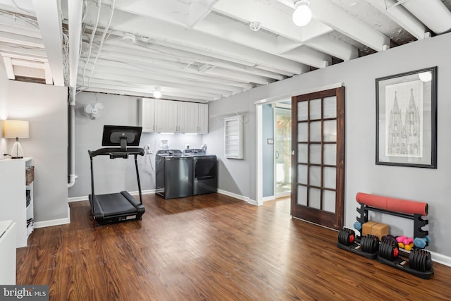 exercise room with separate washer and dryer and dark hardwood / wood-style floors