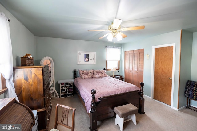 bedroom with ceiling fan and carpet