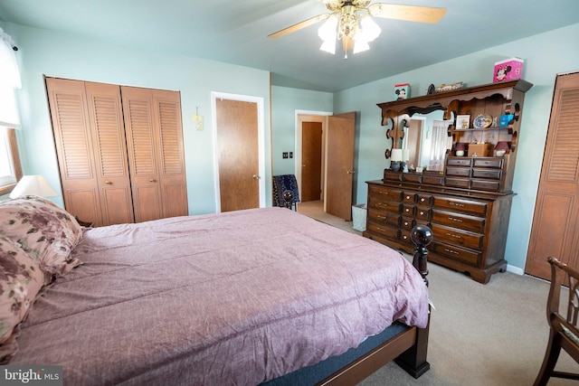 bedroom featuring ceiling fan and light carpet