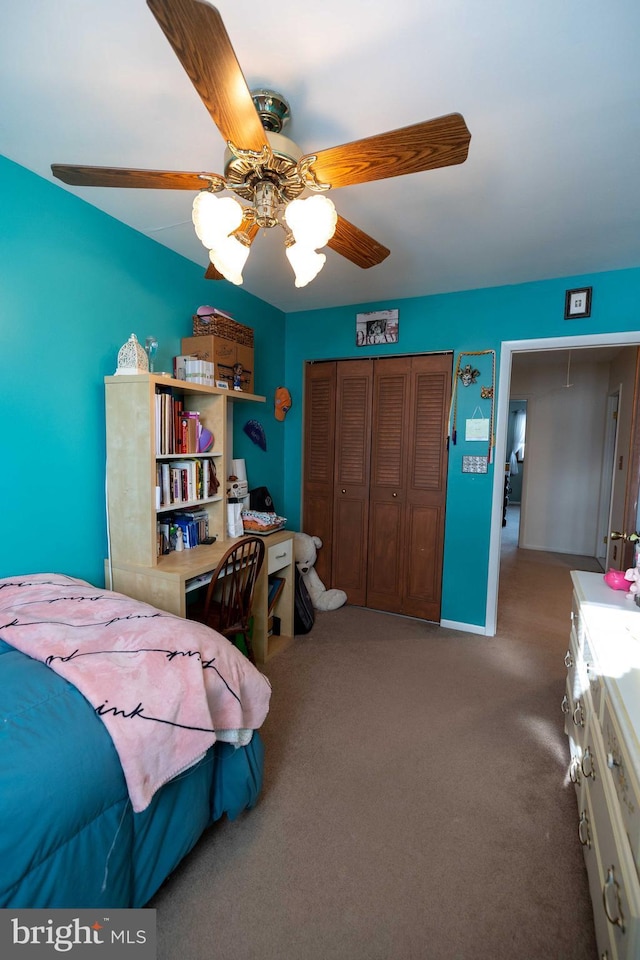 bedroom with ceiling fan, a closet, and carpet