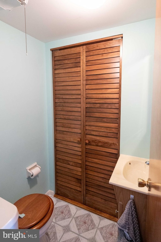 bathroom featuring vanity and toilet