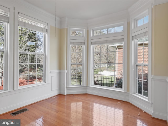 unfurnished sunroom featuring plenty of natural light