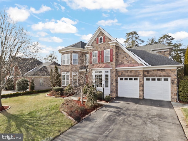 view of front facade with a garage and a front lawn