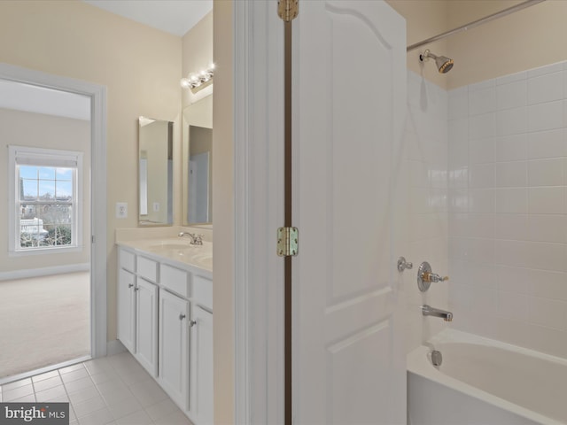 bathroom featuring vanity, tub / shower combination, and tile patterned flooring