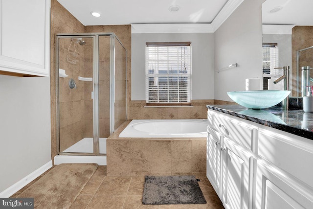 bathroom with ornamental molding, tile patterned floors, separate shower and tub, and vanity