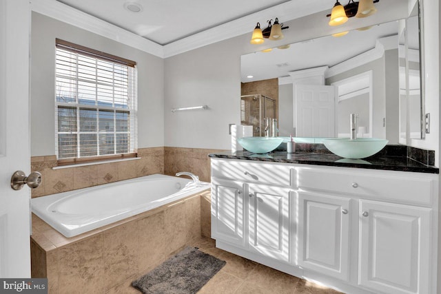 bathroom featuring vanity, tile patterned flooring, crown molding, and independent shower and bath