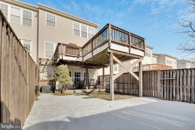 back of house featuring a wooden deck