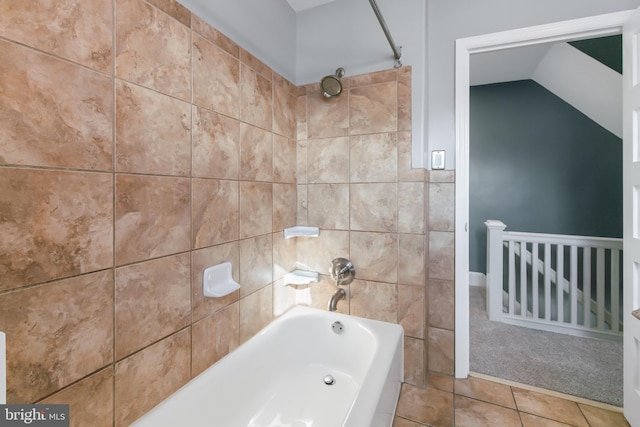 bathroom with tile patterned flooring and tiled shower / bath