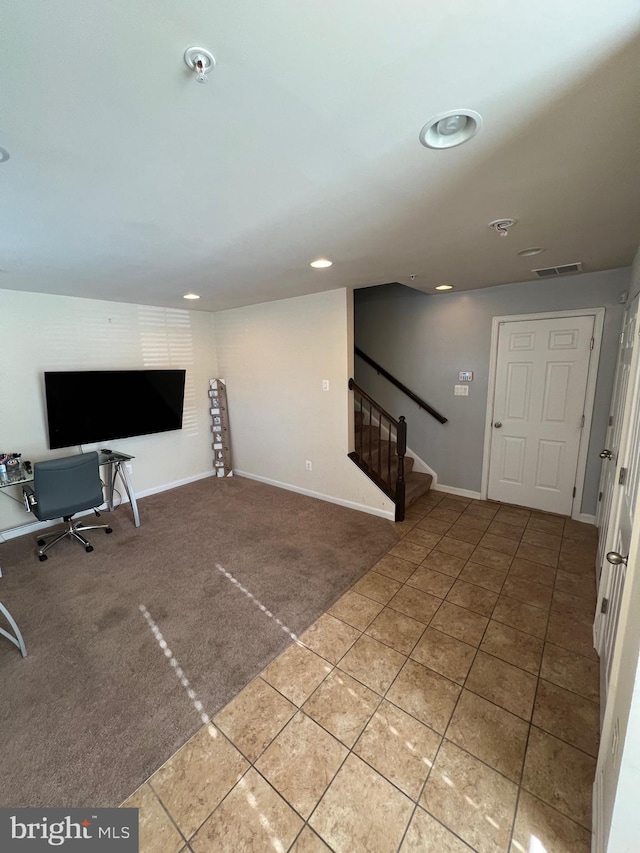 unfurnished living room featuring carpet