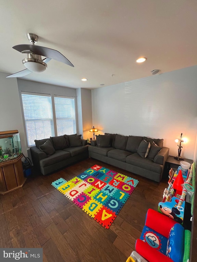 living room with dark hardwood / wood-style floors and ceiling fan