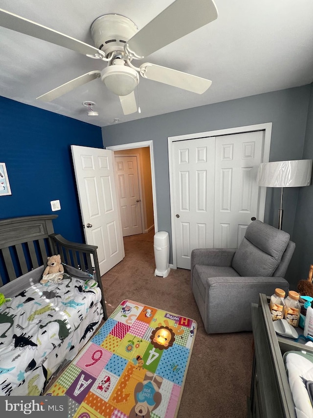 carpeted bedroom featuring a closet and ceiling fan