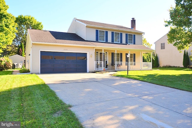 colonial inspired home featuring a garage, covered porch, and a front yard