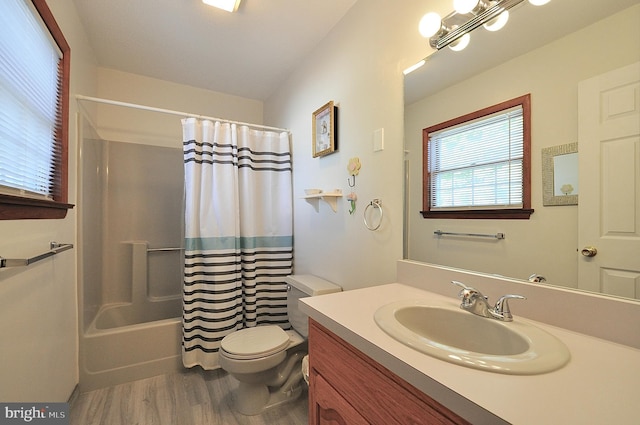 full bathroom featuring shower / bathtub combination with curtain, vanity, wood-type flooring, and toilet