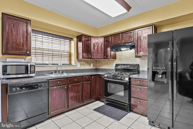 kitchen with sink, black appliances, tasteful backsplash, and light tile patterned flooring