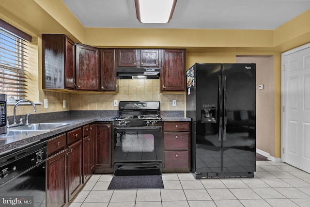 kitchen with backsplash, black appliances, sink, light tile patterned floors, and dark brown cabinets