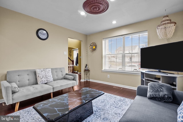 living room with dark hardwood / wood-style flooring