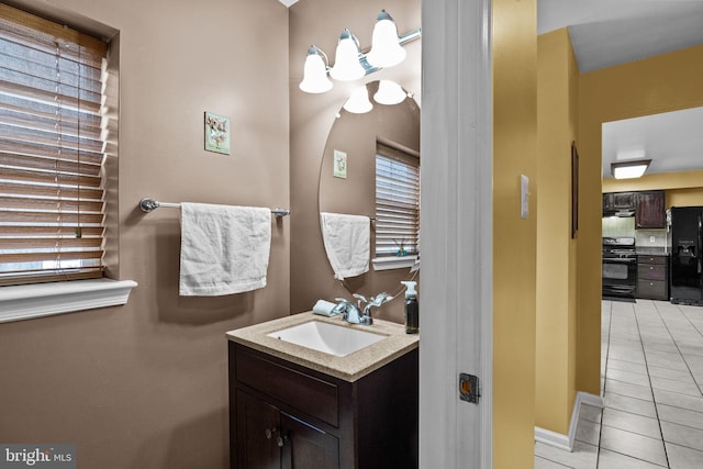 bathroom with vanity and tile patterned flooring