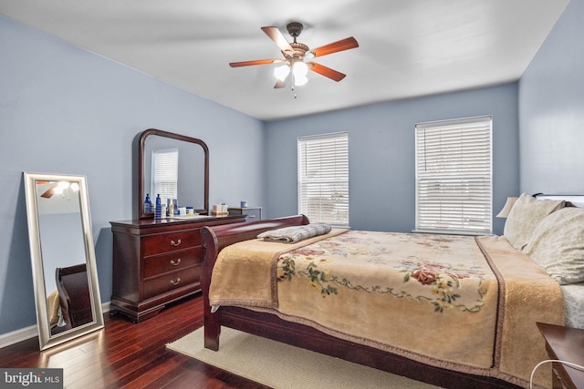 bedroom with dark wood-type flooring and ceiling fan