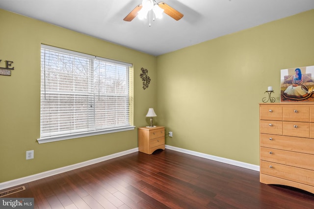 bedroom with ceiling fan and dark hardwood / wood-style floors