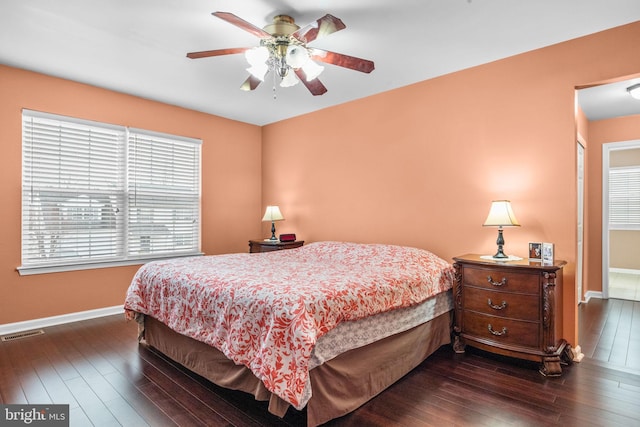 bedroom featuring ceiling fan and dark hardwood / wood-style flooring