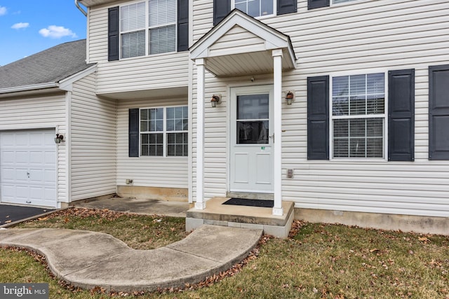 property entrance with a garage