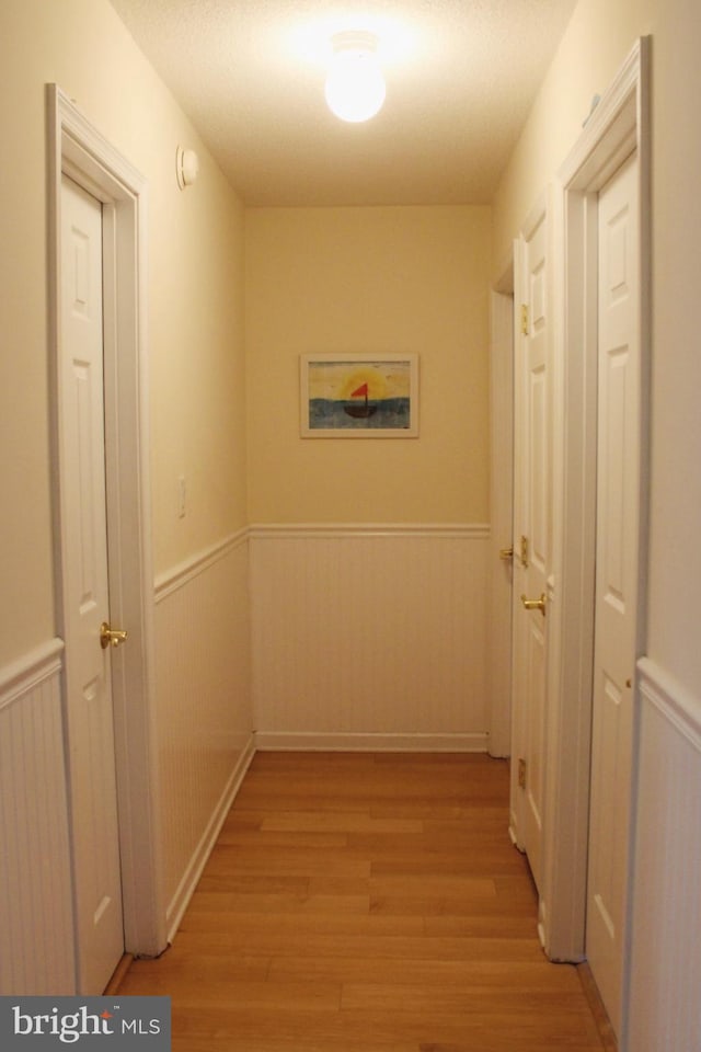 corridor featuring light hardwood / wood-style floors