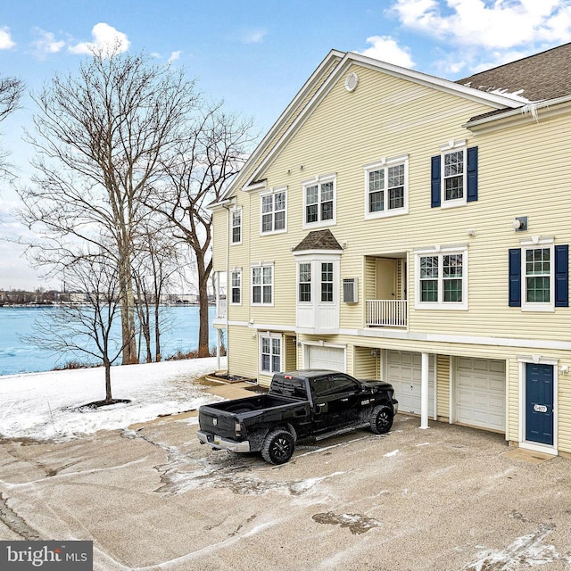 view of front of property with a water view