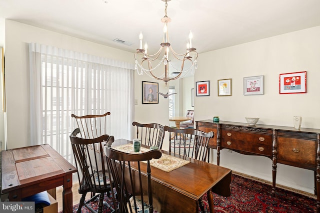 dining area with a notable chandelier