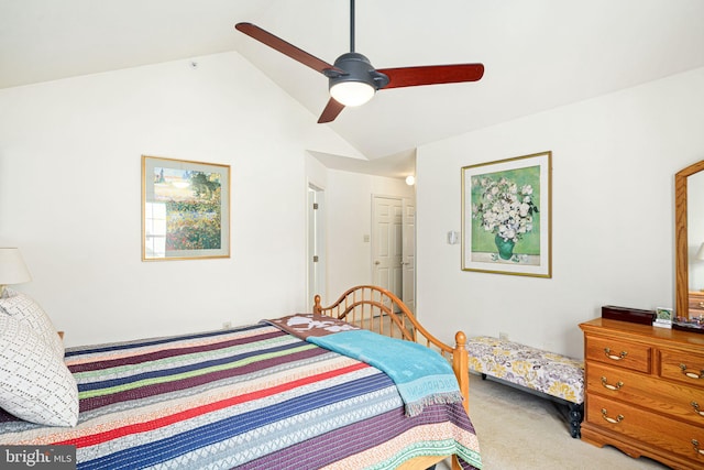 carpeted bedroom featuring lofted ceiling, ceiling fan, and a closet