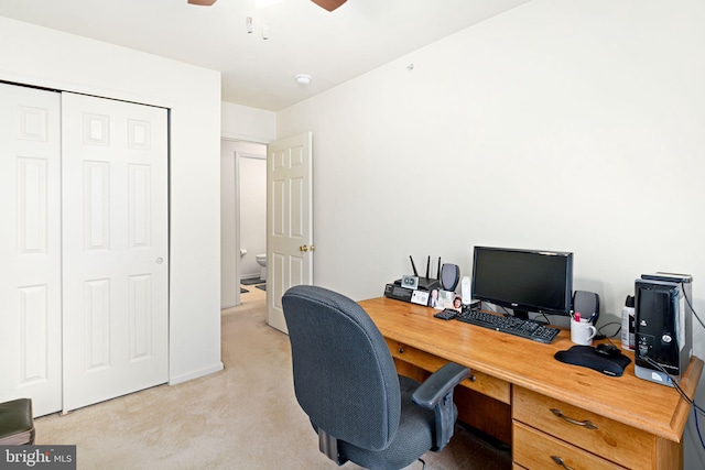 office with ceiling fan and light carpet