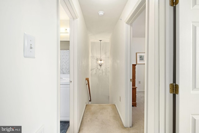 corridor with light colored carpet