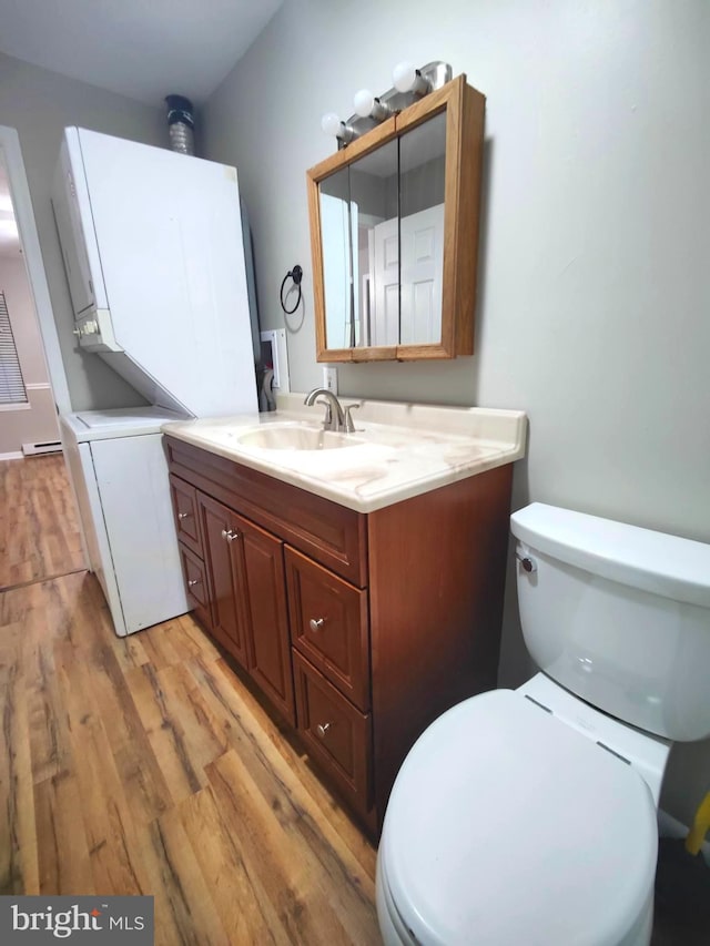 bathroom featuring hardwood / wood-style flooring, vanity, and toilet