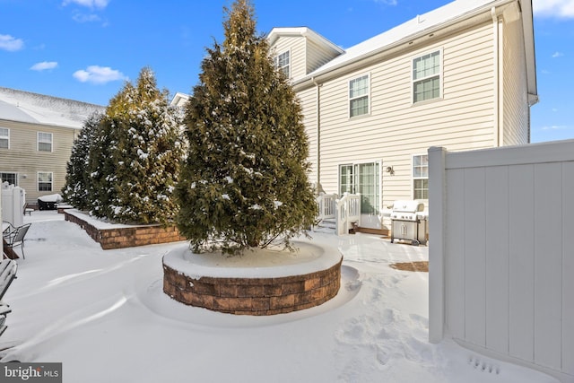 view of snow covered property