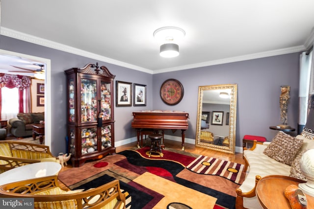 living room with ceiling fan, wood-type flooring, and crown molding