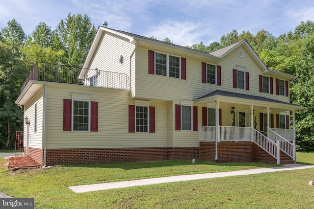 view of front of property featuring a porch and a front yard