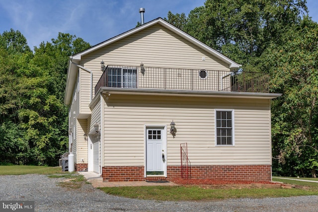 view of front of home with a balcony