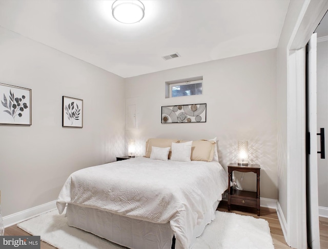 bedroom featuring hardwood / wood-style flooring