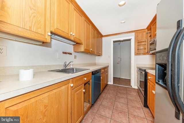 kitchen featuring light tile patterned floors, sink, and stainless steel appliances