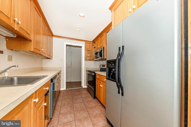 kitchen with light tile patterned flooring, appliances with stainless steel finishes, crown molding, and sink