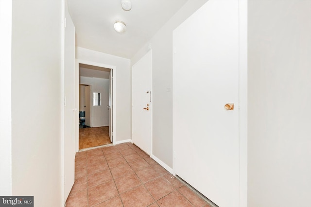 hallway with light tile patterned flooring