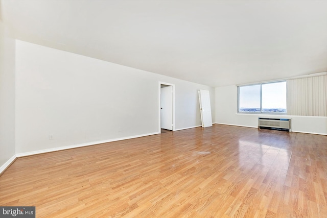 unfurnished living room with light wood-type flooring